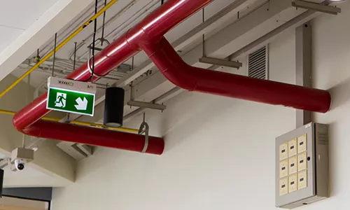 Pipes through fire rated wall