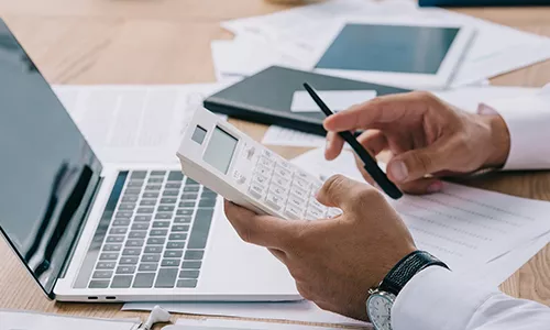 hands with calculator