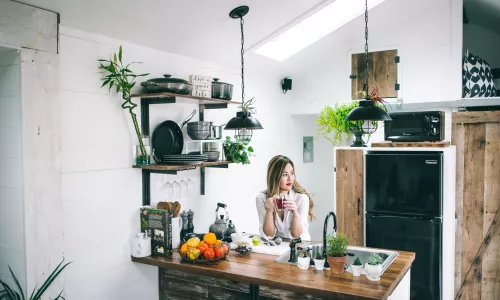 Woman drinking tea in her apartment