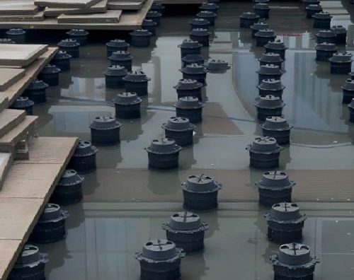 ponding water under pedestal tiles 