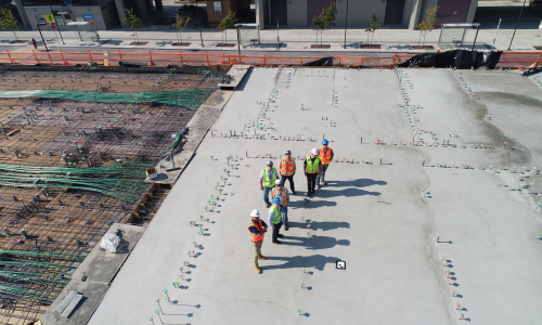 Workers on top of a roof