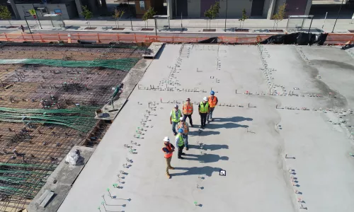 Workers on top of a roof