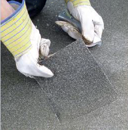 Removing part of old insulation during roofscan