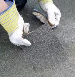 Removing part of old insulation during roofscan